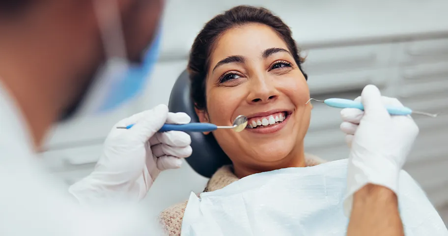 Smiling woman in dentist chair