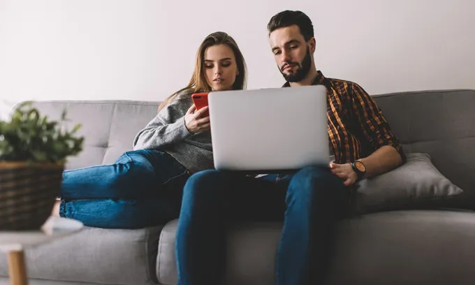 Couple comparing mobile and internet plans