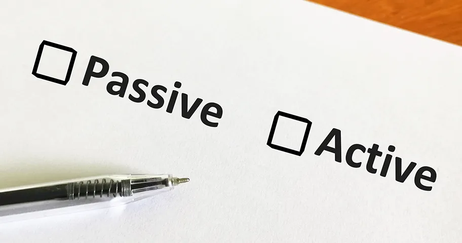 Pen and paper with two tick boxes marked passive and active.