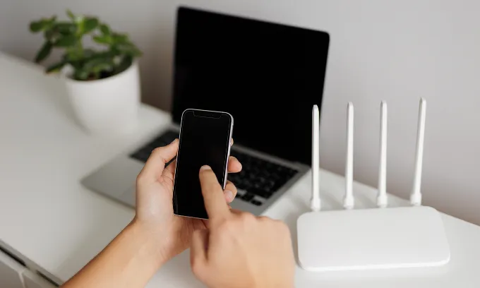 Close up of a person checking their mobile phone and internet plan.