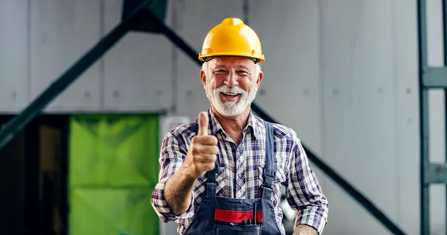 Cheerful older male construction worker