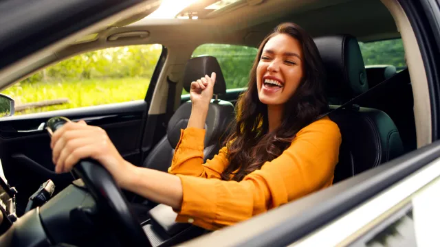 Woman smiling while driving 