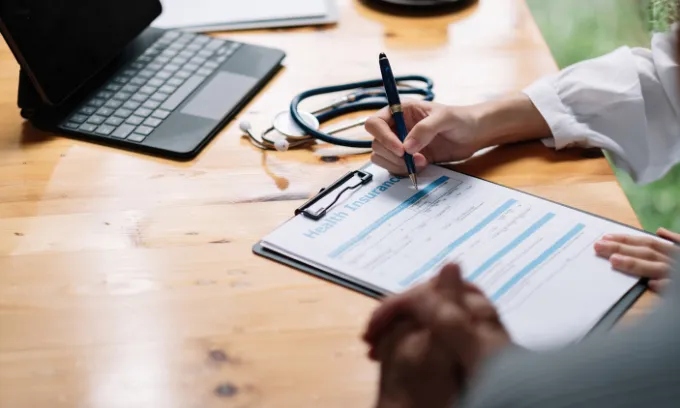 Australian person preparing their health insurance. 