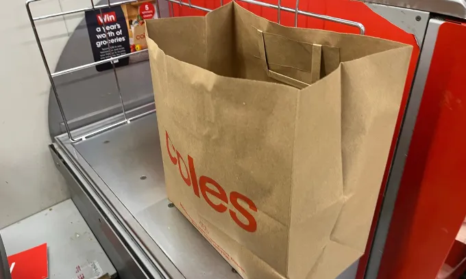 A close up of a Coles paper bag.