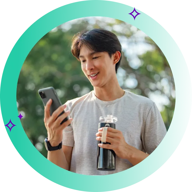 Healthy person looks at phone and smiles