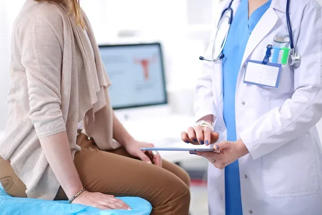 Woman sitting at the doctor's office having a checkup