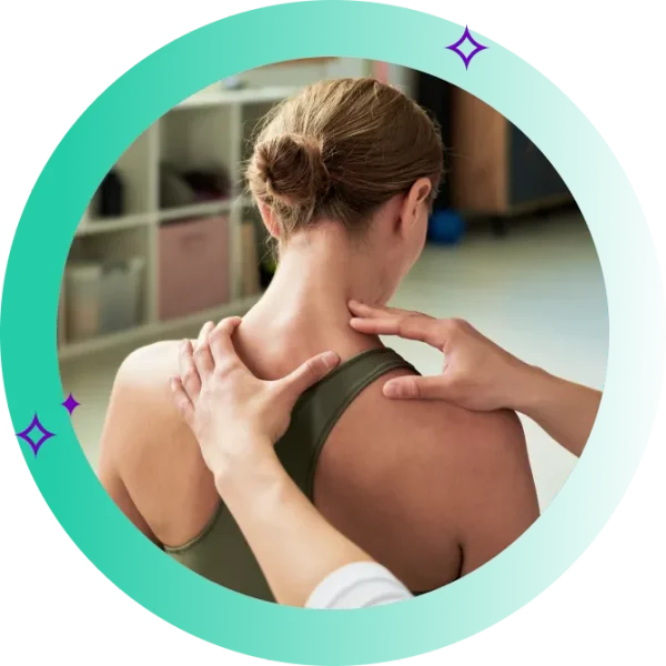 A woman having her trapezius muscle assessed by a physiotherapist
