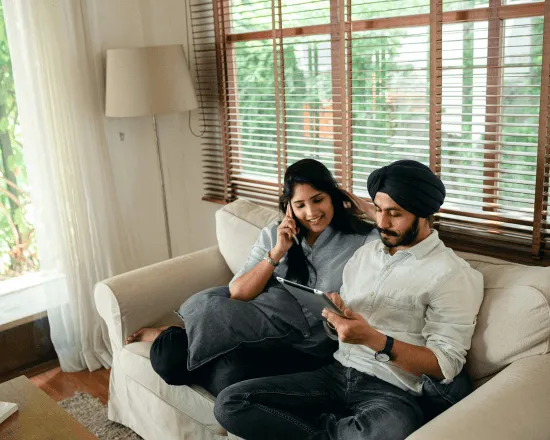 Couple comparing energy plans on a tablet