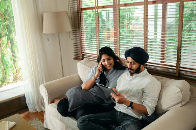 Couple comparing energy plans on a tablet