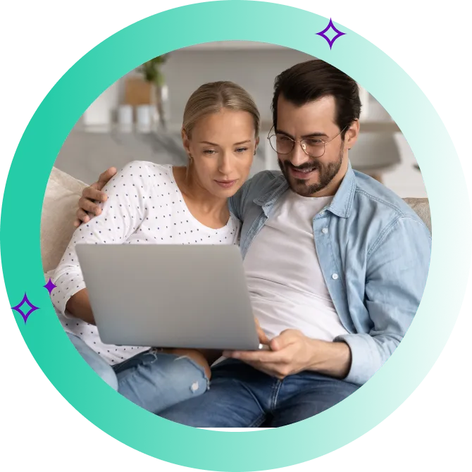 A young couple comparing fast personal loans on a laptop
