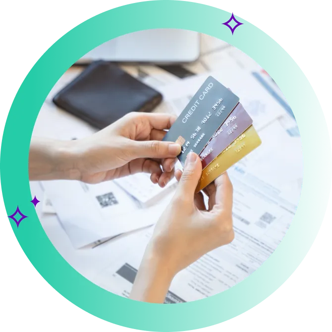 A close up of someone reviewing their credit cards before they compare personal loans for debt consolidation