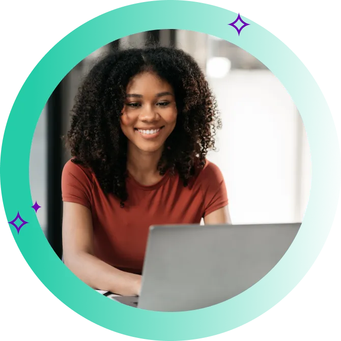 Woman happily reviewing and comparing her personal loan options on her laptop