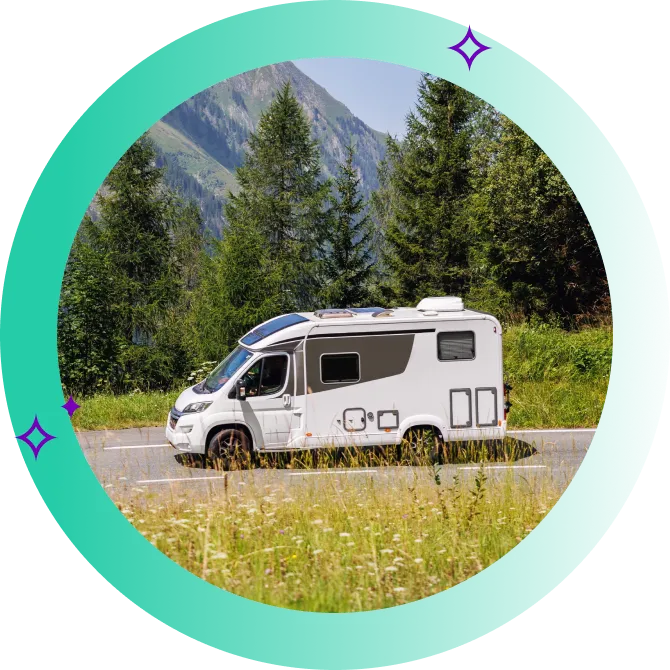 A caravan driving along a scenic countryside road