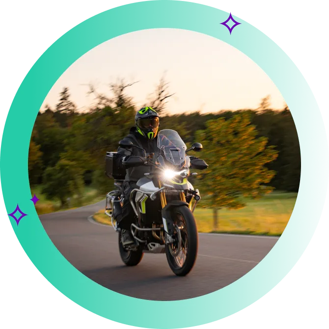 Person riding a motorcycle along the countryside roads