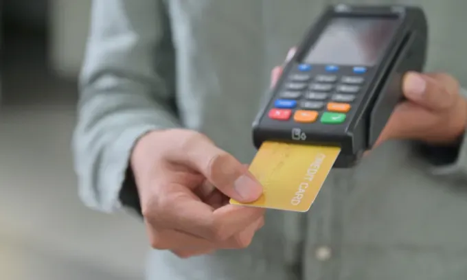 Someone paying with a credit card.
