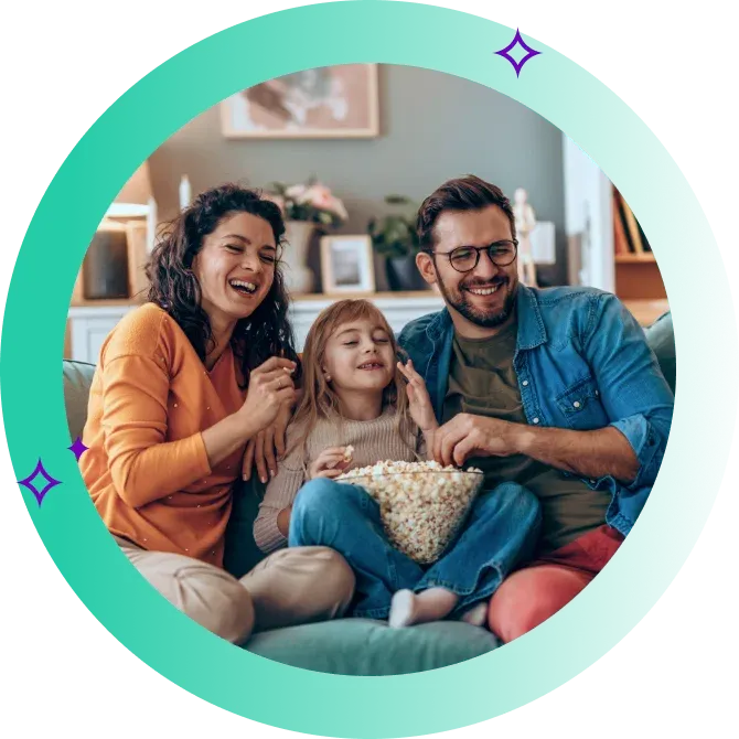 Family sit together and each popcorn