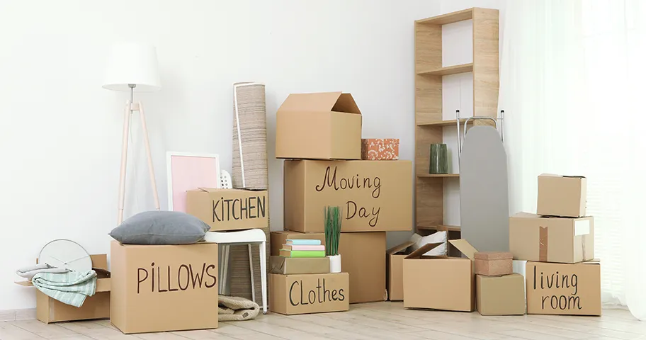 Stack of packing boxes and household items