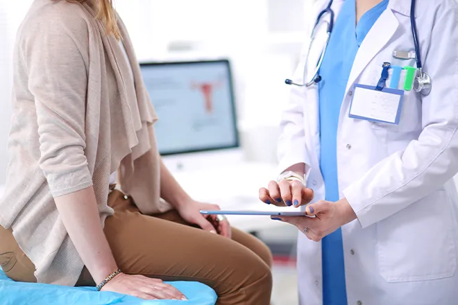 Close-up of woman having check-up with female doctor