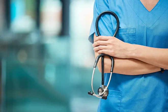 Close-up of medical worker holding stethoscope