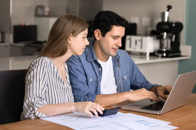 Couple comparing home loan policies