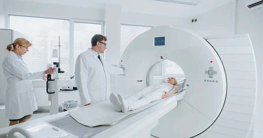 Radiologist and doctor performing MIR scan on patient