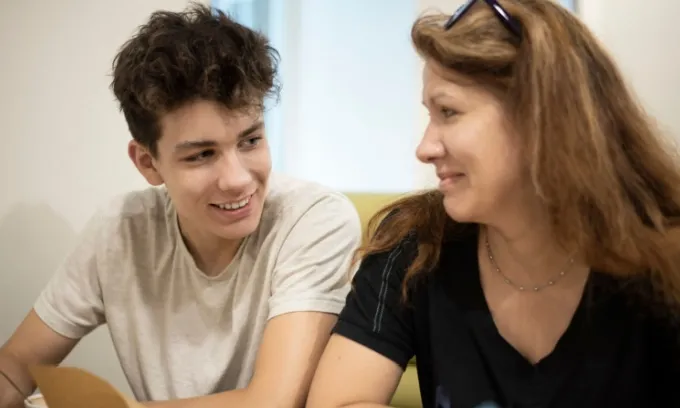 A mother and son discuss how long he can stay on his parents' health insurance