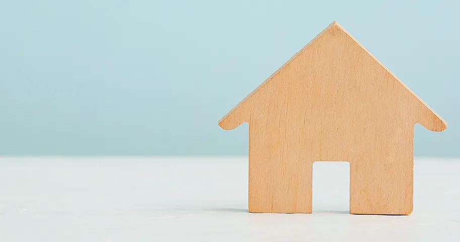 Simple wooden cutout of the outline of a house