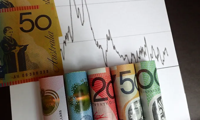 Close up of Australian bills with a graph.