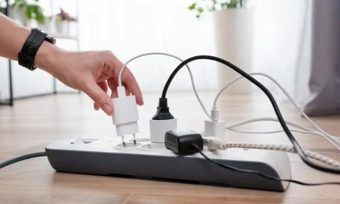 Man unplugging power cords. 