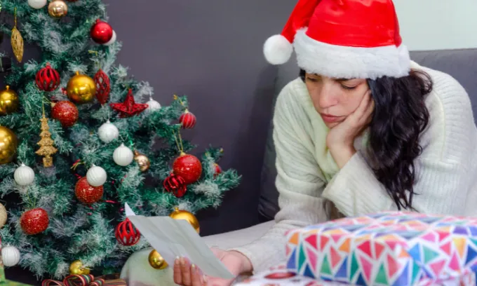 Woman is stressed thinking about Christmas.