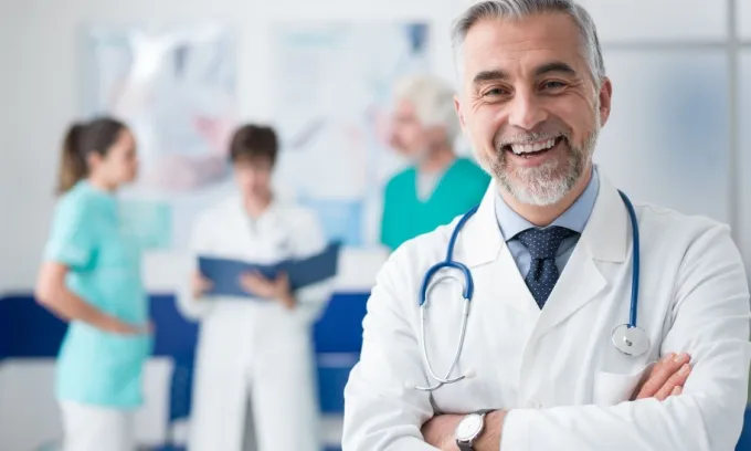 A smiling older male doctor
