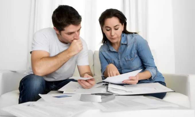 Couple looking at bills.
