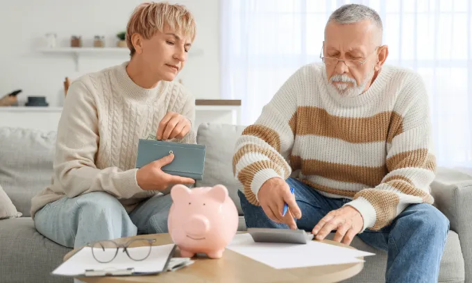 Couple calculating their offset net balance.