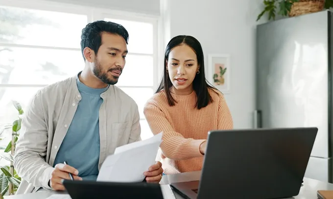 Couple looking at NBN bill