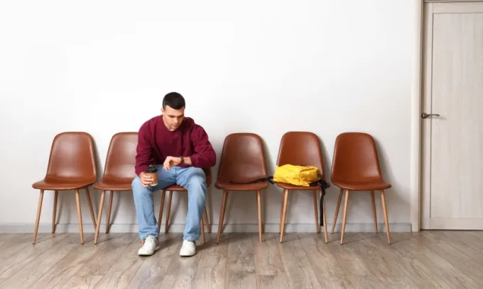 A man waits in a doctor's waiting room