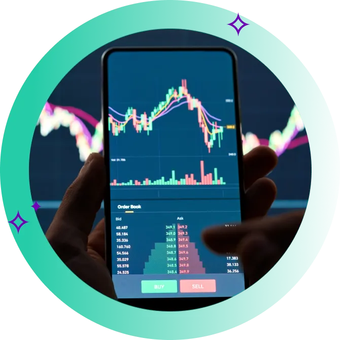 Close-up of online share trading app on phone in front of monitor featuring stock price graph.