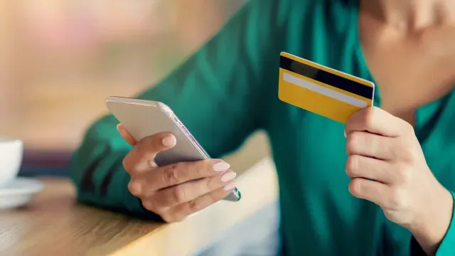 Woman filling in her details to check her credit score online