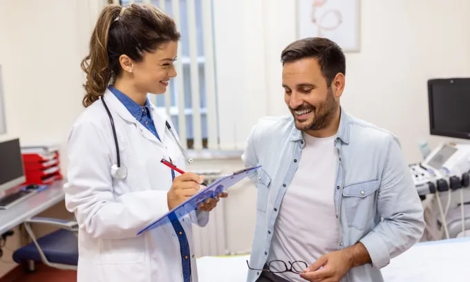A doctor explains the private health insurance rebate tiers to a patient.