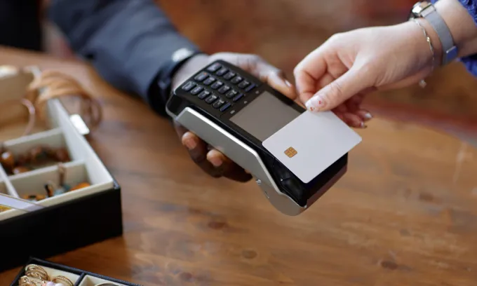 Paying with a card.