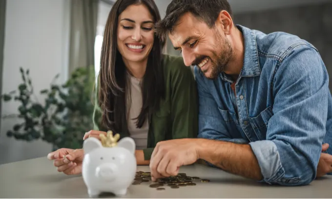 A couple saving money.