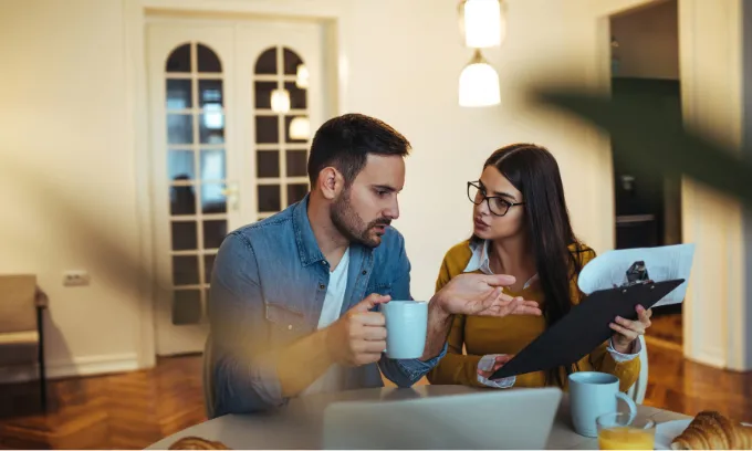 A couple comparing their home loan after the September RBA cash rate decision.