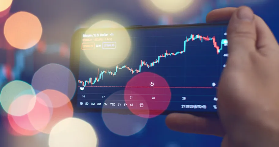 Graphic showing hand holding cellphone executing buying or selling shares.
