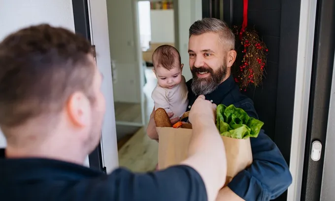 Person receiving grocery delivery