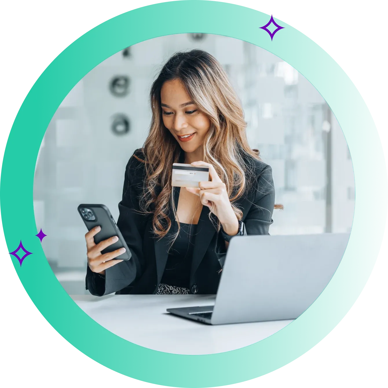 Business woman reviewing registering their new business transaction bank account on her phone in front of her laptop