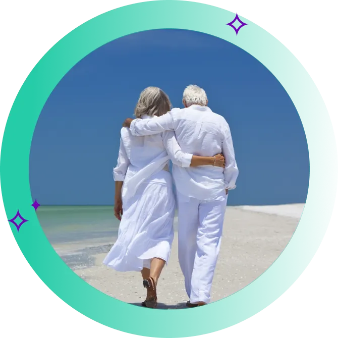 Older couple with back to viewer walking on tropical beach