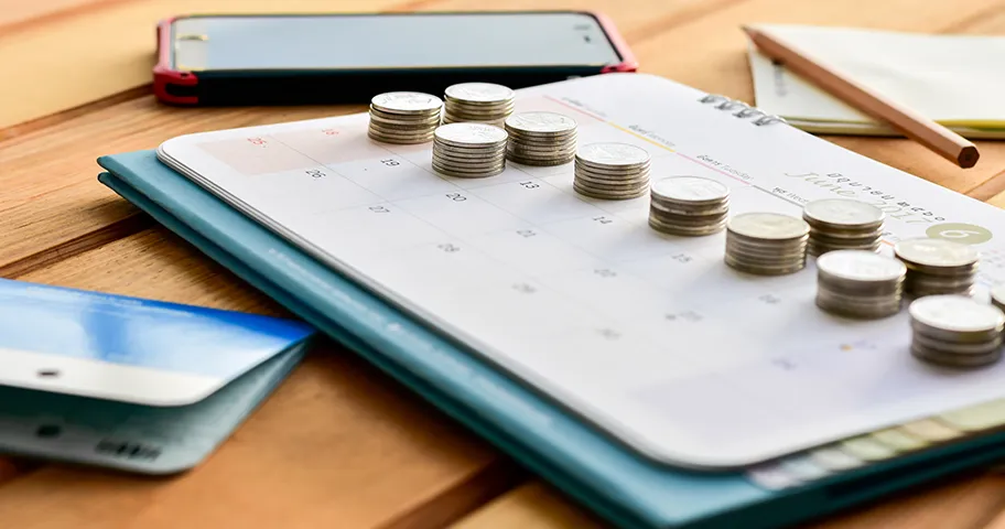 Coins places on different days on calendar.