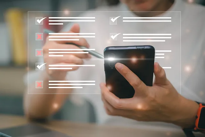 mobile phone close-up with ticked-list graphic