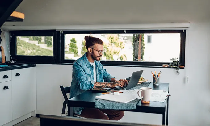 Man using internet to pay bills