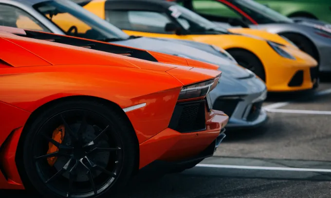 Exotic supercars assembled at a parking lot